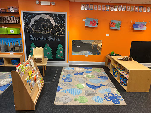 Photo of Urban Child Academy's Gold Coast Toddler's room- bookshelf and play area